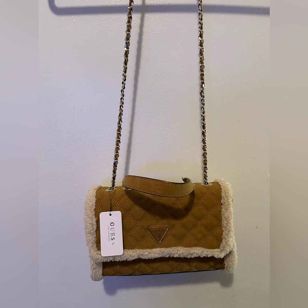 NWT: A Guess handbag/crossbody. Color is honey mustard